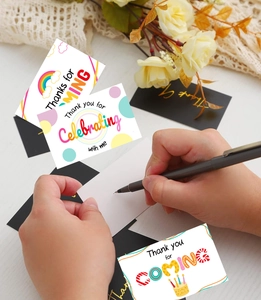 Detail of thank you cards with gold foil lettering and various cartoon designs