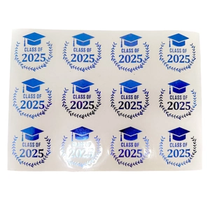 Detail of 12 blue foil Class of 2025 graduation cap stickers on a single sheet