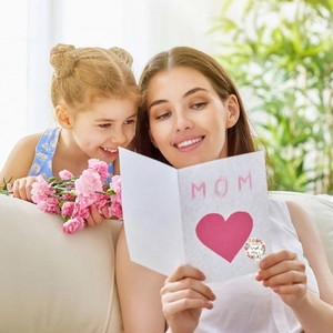 Happy Mother's Day floral heart stickers and greeting card shown in a warm home setting