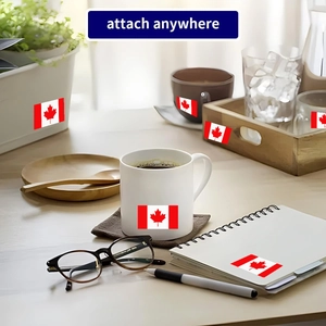Square Canadian flag stickers with maple leaf design applied to laptop and water bottle