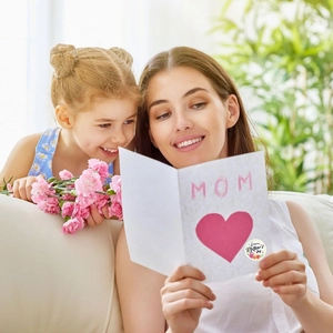 Detail of Happy Mother's Day sticker on white card with heart and pink carnation flowers