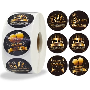 Macro view of six black and gold Happy Birthday stickers with festive party patterns