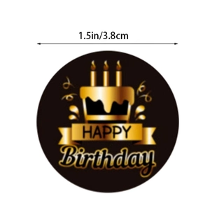 Detailed view of round 1.5 inch Happy Birthday sticker with gold cake and black background
