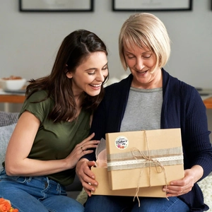 Detail showing Happy Mother's Day sticker sealing a vintage kraft paper gift box