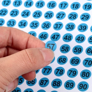 Blue round stickers with black numbers 1-100 for office labeling and warehouse sorting