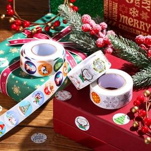 Roll of Christmas and New Year decorative labels with Santa and snowman motifs