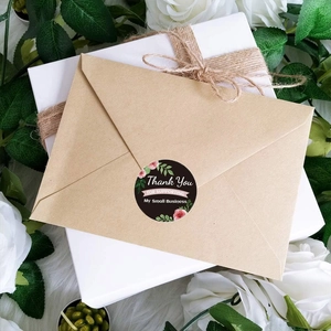 Floral black thank you stickers for small business on kraft envelopes and gift box