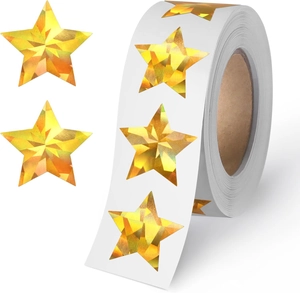 Macro detail of gold laser star stickers in a bulk roll on a white background