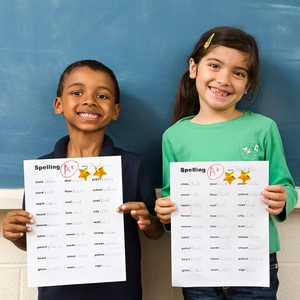 Students holding A+ spelling tests decorated with golden holographic star stickers