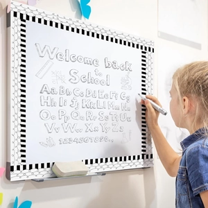 Magnetic school bulletin board with black white stripes border and alphabet letters