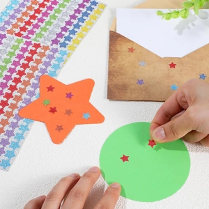 Colorful glitter star stickers for gift rewards and DIY crafts on white background
