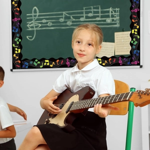 Blackboard music border trim with colorful musical notes and wavy edges for classroom decor