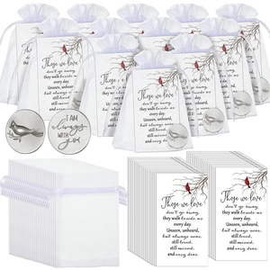 Detail of 12 bereavement memorial cards with cardinal birds and silver memorial tokens