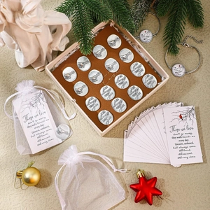 Close-up of bereavement cardinal token set with memorial cards and organza bags