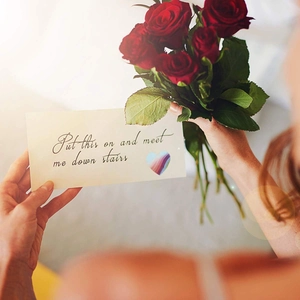 Valentine's Day gift card with red roses and heart sticker featuring romantic quote
