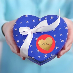 Blue heart gift box with gold foil star pattern and a red 'with love' heart sticker