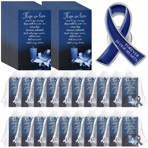 Funeral memorial cards with enamel heart pins and white organza bags for guests