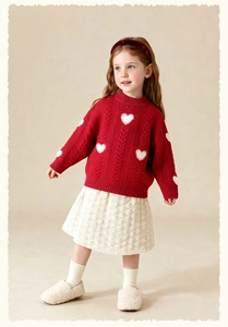 Red knit sweater with white heart pattern and beige textured skirt for girls