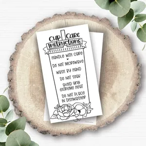 Detailed tumbler care instruction card with floral line art on a rustic wood background