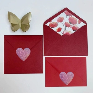 Premium red envelopes with floral lining and glittery heart stickers for gift sealing