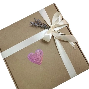 Kraft gift box with purple glitter heart sticker, white satin ribbon and dried lavender