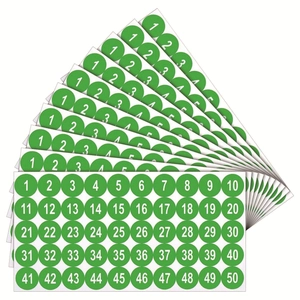 Macro detail of waterproof green round stickers numbered 1-50 with white bold font