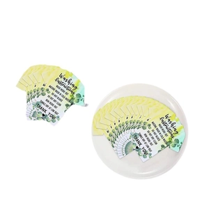 Washing instruction cards with green leaf design and laundry care symbols on white background