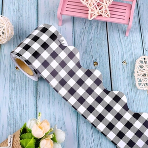 Close-up of black and white checkered scalloped border stickers for classroom display