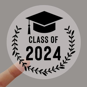Macro detail of a transparent Class of 2024 graduation cap sticker with laurel leaves