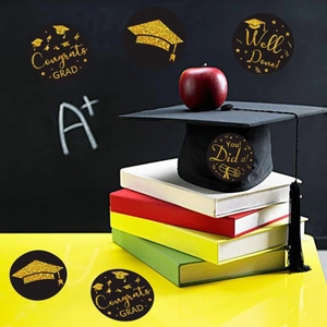 Round black and gold graduation stickers featuring congrats grad text on a school background