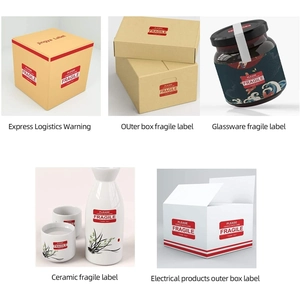 Detail of red fragile stickers on cardboard boxes and glass jars for safe shipping