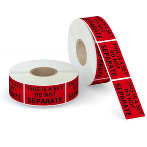 Rolls of red This Is A Set Do Not Separate warning labels for shipping and logistics