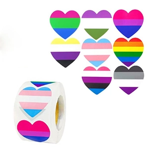 Detailed view of heart-shaped rainbow stickers on a roll for Valentine's Day decor