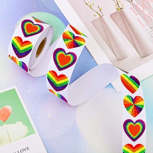 Holographic rainbow heart stickers roll for Valentine gifts with colorful stripe patterns