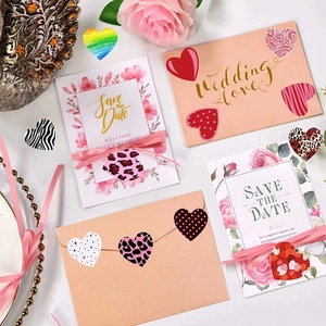 Assorted heart stickers for Valentine's Day on wedding invitations and pink envelopes