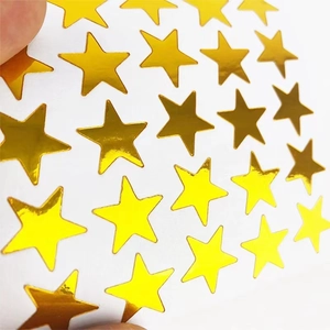Shiny gold star foil stickers for kids rewards and gift decoration on white background