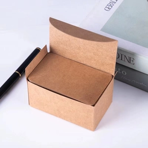 Mini kraft paper storage box with rounded corner DIY cards next to a pen and book
