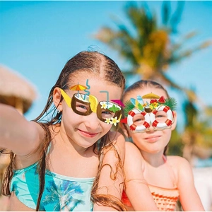 Children wearing tropical summer party glasses with coconut and lifebuoy theme designs