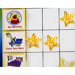 Holographic gold star stickers on reward chart for kids good behavior tracking