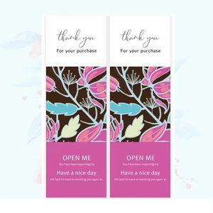Detail of rectangular floral Open Me stickers for bakery boxes and gift packaging
