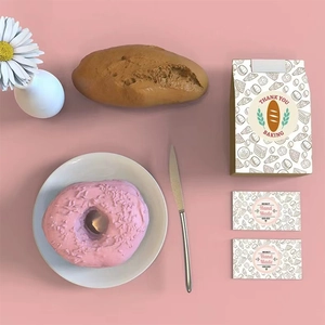 Hand Made adhesive seal stickers on bakery packaging with artificial bread and donuts