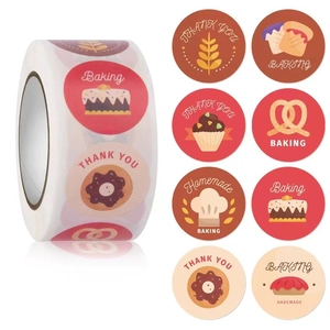 Roll of round baking stickers with wheat and cake patterns for food packaging seal