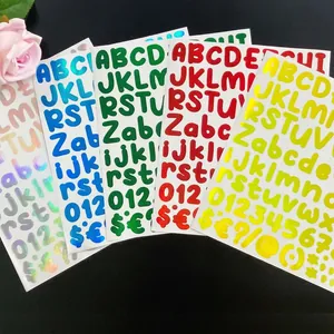 Macro view of colorful laser alphabet stickers for cups and laptop decorations