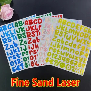 Macro detail of laser alphanumeric stickers with fine glitter texture in five colors