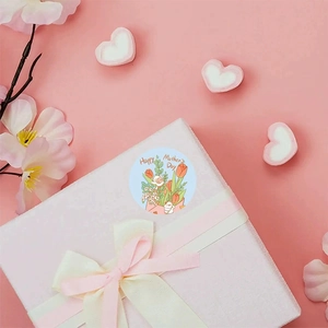 Floral Happy Mother's Day round gift sticker with tulips on white box and pink ribbon