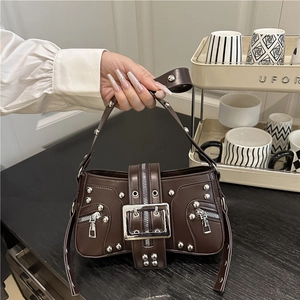 Vintage brown punk handbag with silver rivets and metal buckle in chic retro design