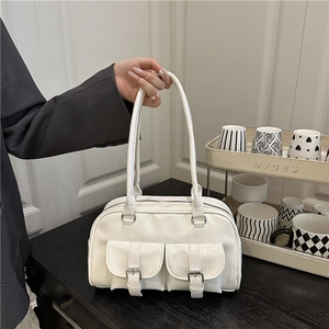 Glossy white patent leather bowling bag with front pockets and silver hardware detail
