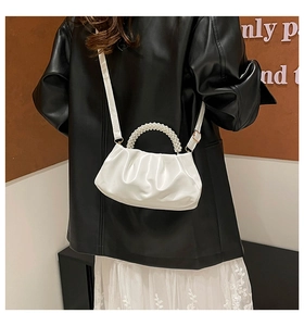 White ruched cloud bag featuring decorative pearl handle and adjustable shoulder strap
