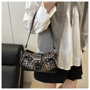Close-up of leopard print baguette bag featuring silver hardware and Y2K aesthetic