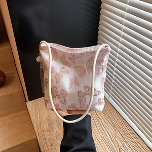 Bolso saco rosa de estilo chino moderno con bordado de mariposa y borlas de seda